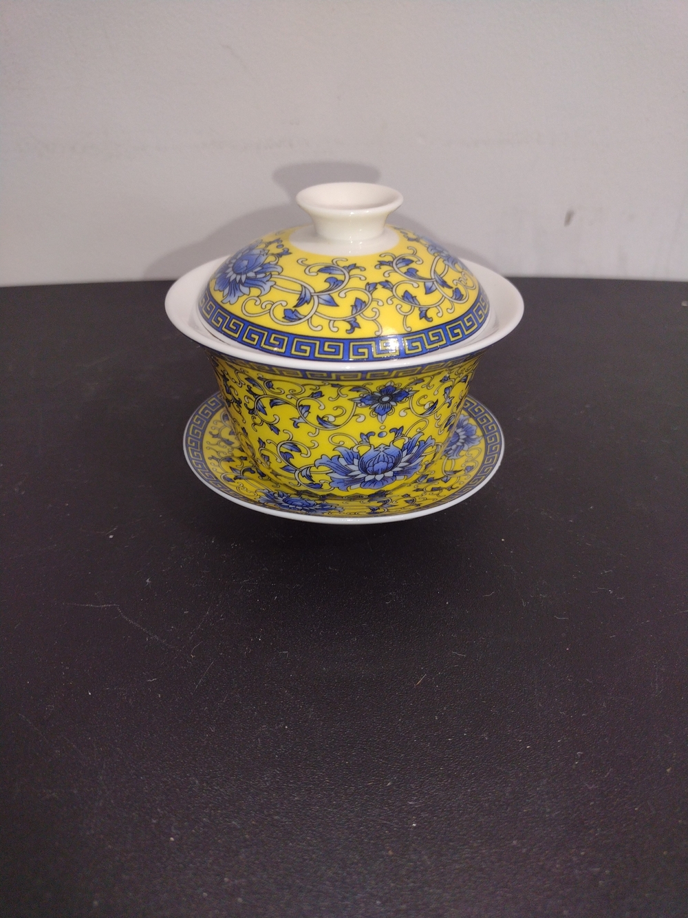 Yellow and Blue Porcelain Lidded Teacup with Saucer